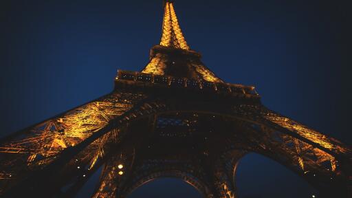 Eiffel Tower lit up at night uhd