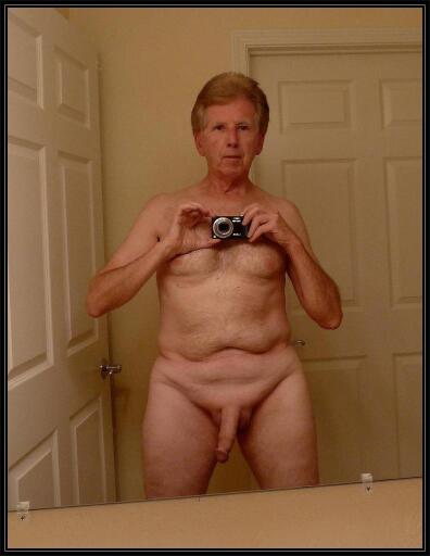 Andrew self photo standing nude in the bathroom.