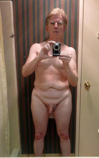 Andrew self photo standing nude in the bathroom