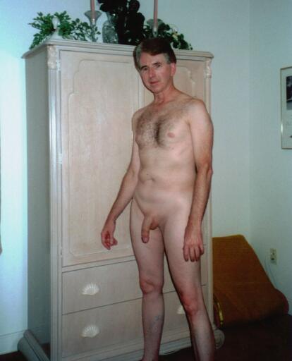Andrew nude standing in the bedroom
