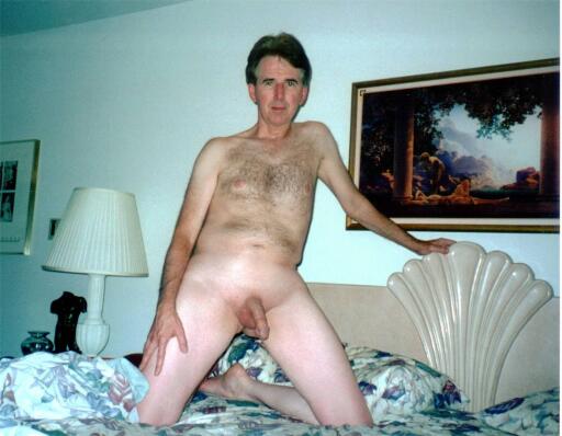 Andrew nude kneeling on the bed (1)