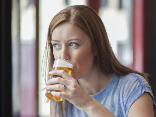 Woman drinking a beer