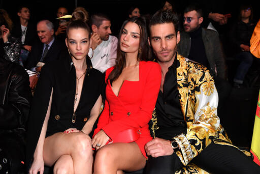 MILAN, ITALY - FEBRUARY 21: Barbara Palvin, Emily Ratajkowski and Jon Kortajarena attend the Versace