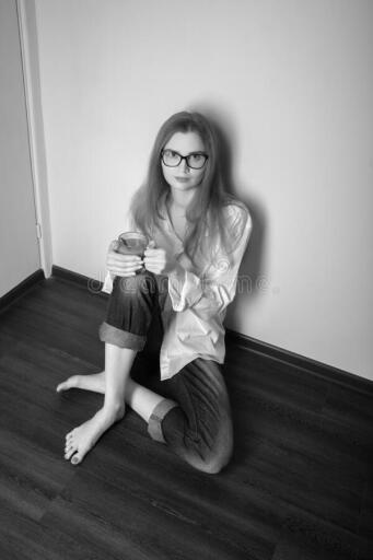 woman quarantine young sitting floor mug tea looks camera monochrome 178104022