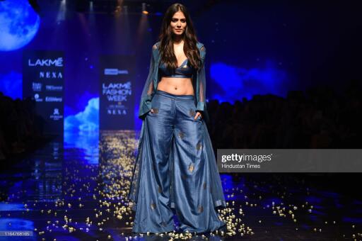 MUMBAI, INDIA - AUGUST 21: Indian actor Malavika Mohanan walks the ramp showcases the outfit of fash