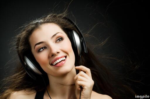Beautiful girl listening to the music on headphone smiling white teeth fruity lips