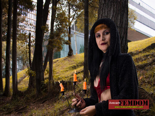 livecamfemdom redhead Dominatrix with candles in the woods