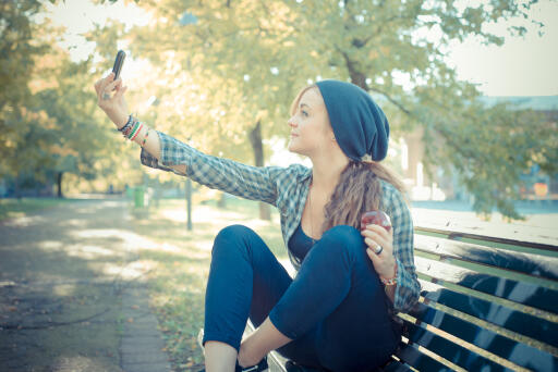 Girl taking picture with her smartphone iPhone selfie (58) Retina Wallpaper