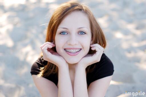 Smiling girl with braces2 Wallpaper