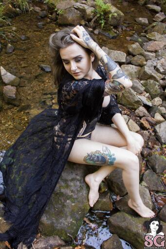 Sitting on the rock tattoo Suicide Girl Nyxana Spellbound