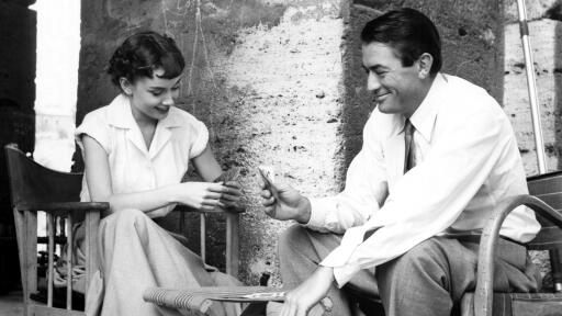Audrey Hepburn and Gregory Peck relax in Rome during a break from shooting the 1953 film "Roman Holi